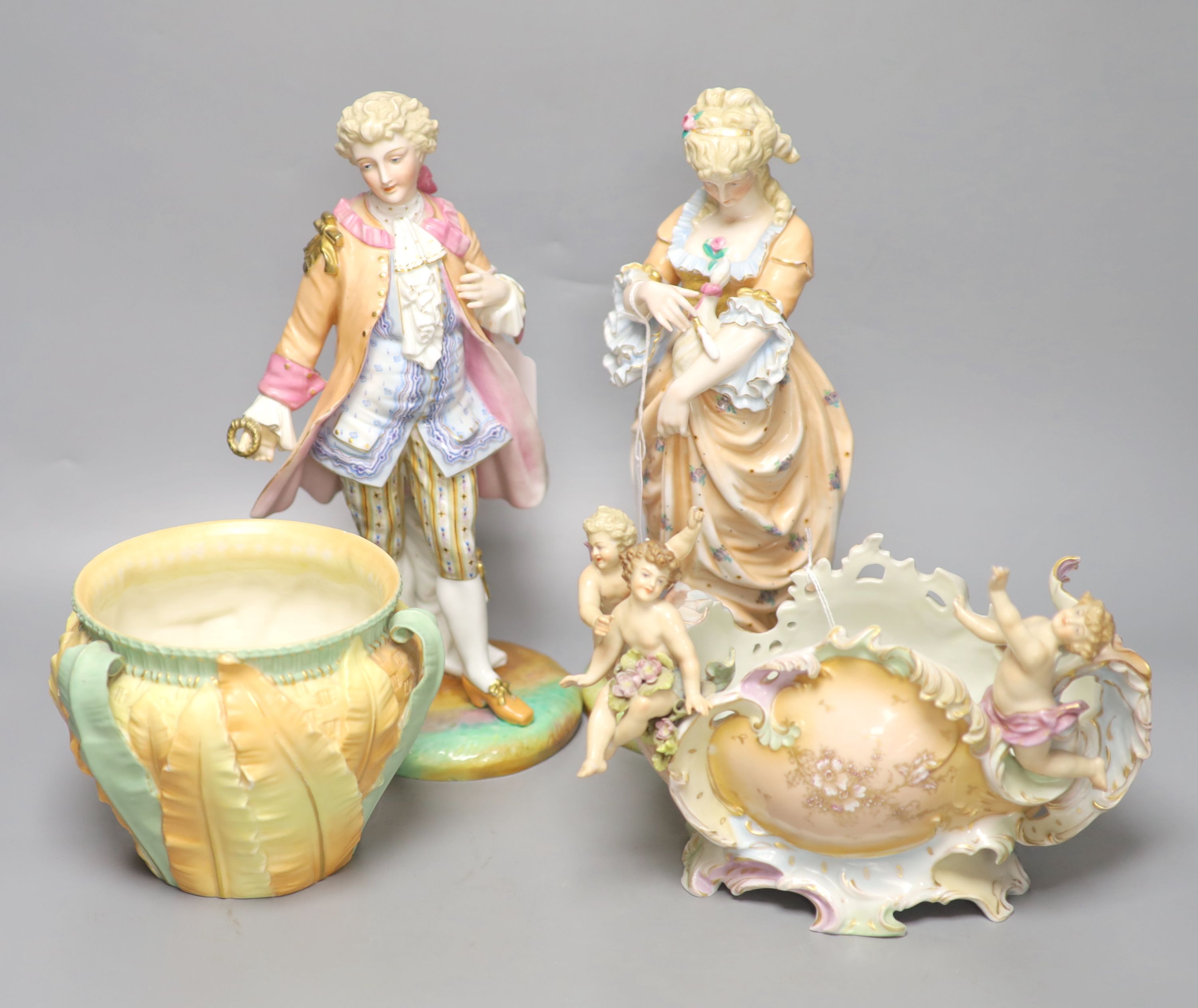 A Royal Worcester leaf-decorated vase, a Continental vase with amorini and a pair of figures of lovers (faults), tallest 29cm